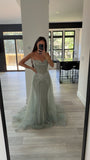 STRAPLESS CRYSTAL EMBELLISHED GOWN WITH OVERSKIRT