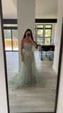 STRAPLESS CRYSTAL EMBELLISHED GOWN WITH OVERSKIRT