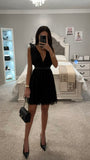 ROBE MINI EN MAILLE SANS MANCHES DOS OUVERT